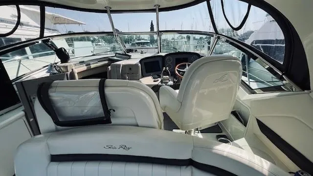 Slide: The Image of Interior view of 2005 Sea Ray 39 Sundancer yacht cockpit with steering wheel and seating. - 5