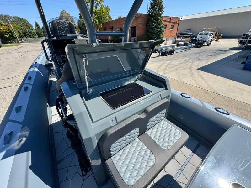Slide: The Image of 2024 Highfield Sport 900 boat interior with open console and seating. - 18