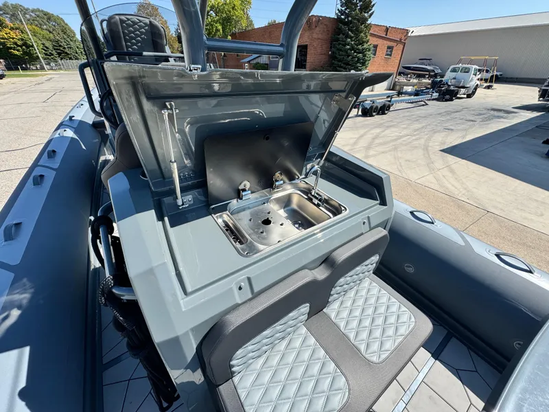 Slide: The Image of 2024 Highfield Sport 900 boat with open storage compartment and seating. - 19