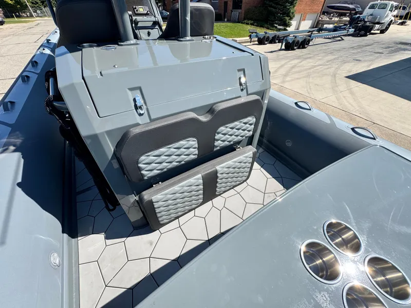 Slide: The Image of 2024 Highfield Sport 900 boat interior with quilted seats and cup holders. - 20