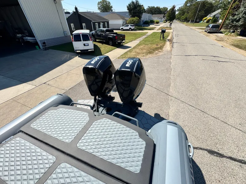 Slide: The Image of 2024 Highfield Sport 900 boat with dual motors on a residential street. - 22