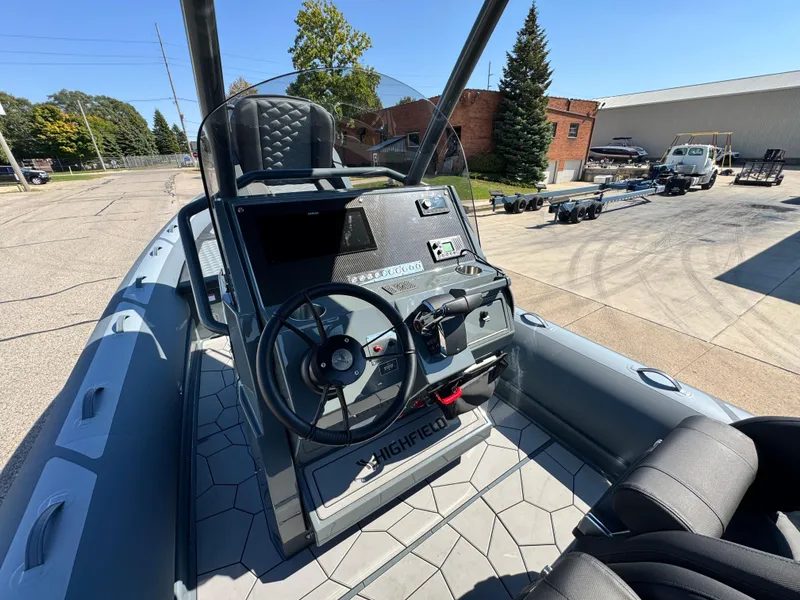 Slide: The Image of 2024 Highfield Sport 900 boat interior with steering wheel and control panel. - 25