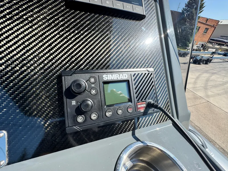 Slide: The Image of Simrad marine device on 2024 Highfield Sport 900 boat dashboard. - 30