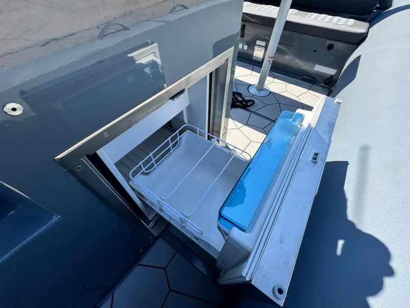 Slide: The Image of 2024 Highfield Sport 900 boat with open storage compartment, showcasing interior design. - 37