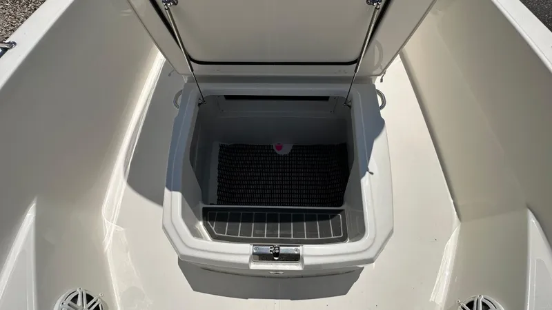 Slide: The Image of Open storage compartment on a 2025 Boston Whaler 220 Dauntless boat. - 19