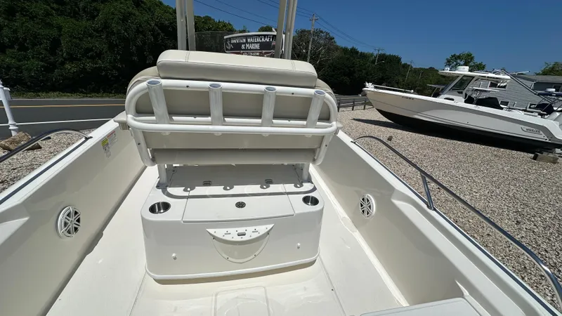 Slide: The Image of 2025 Boston Whaler 220 Dauntless boat interior with seating and rod holders. - 6