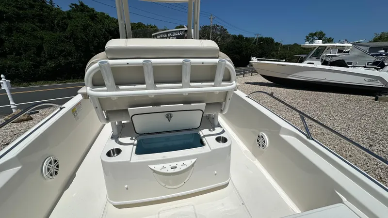 Slide: The Image of 2025 Boston Whaler 220 Dauntless boat interior with seating and storage compartments. - 7