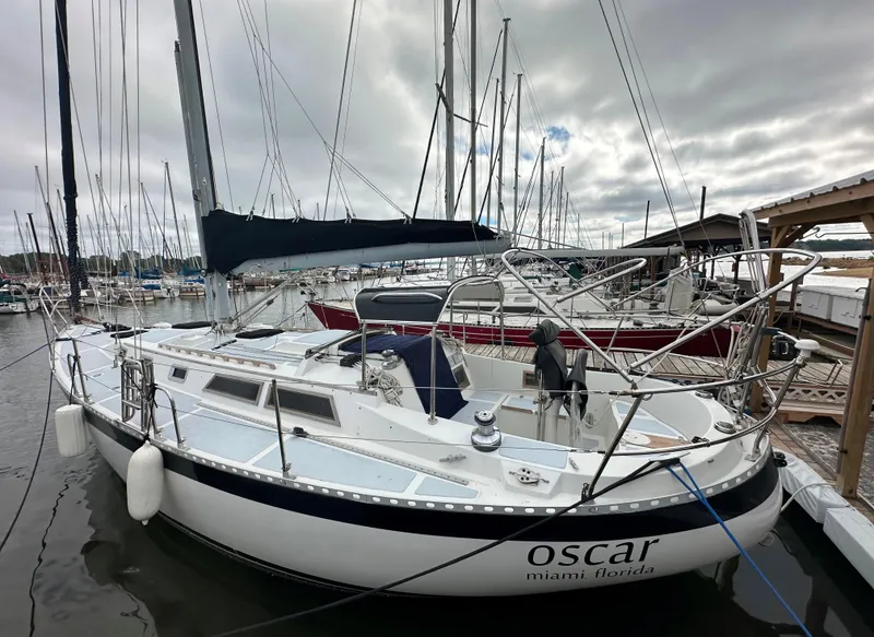 Slide: The Image of 1979 Valiant 37 sailboat docked in marina, overcast sky. - 2
