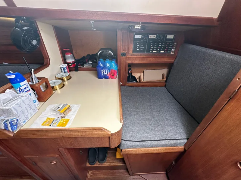 Slide: The Image of 1979 Valiant 37 sailboat interior with navigation station and storage. - 20