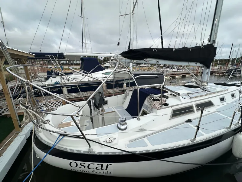 Slide: The Image of 1979 Valiant 37 sailboat docked in marina, named "Oscar" from Miami, Florida. - 3