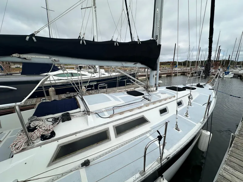 Slide: The Image of 1979 Valiant 37 sailboat docked at marina, overcast sky. - 4