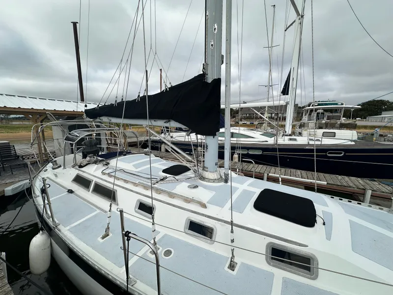 Slide: The Image of 1979 Valiant 37 sailboat docked at marina, overcast sky. - 6