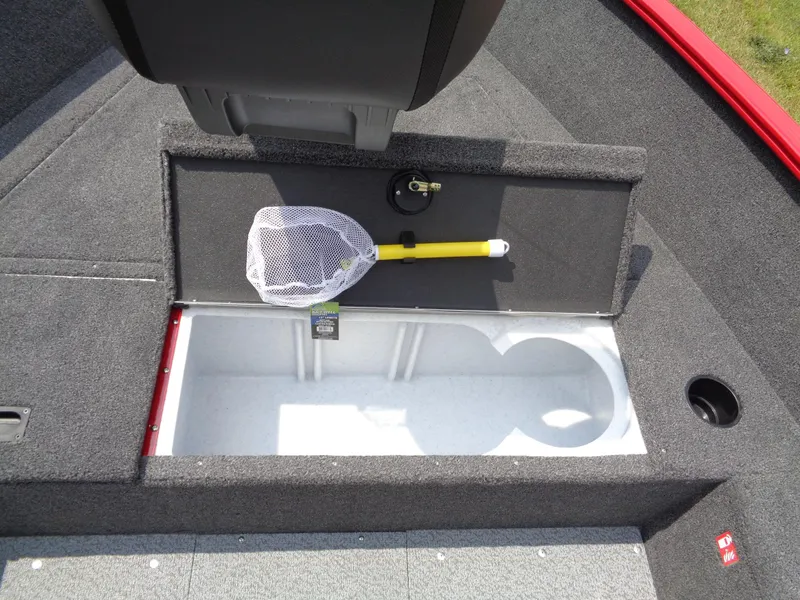 Slide: The Image of 2025 Lund 1650 Rebel XL Tiller boat storage compartment with fishing net. - 6