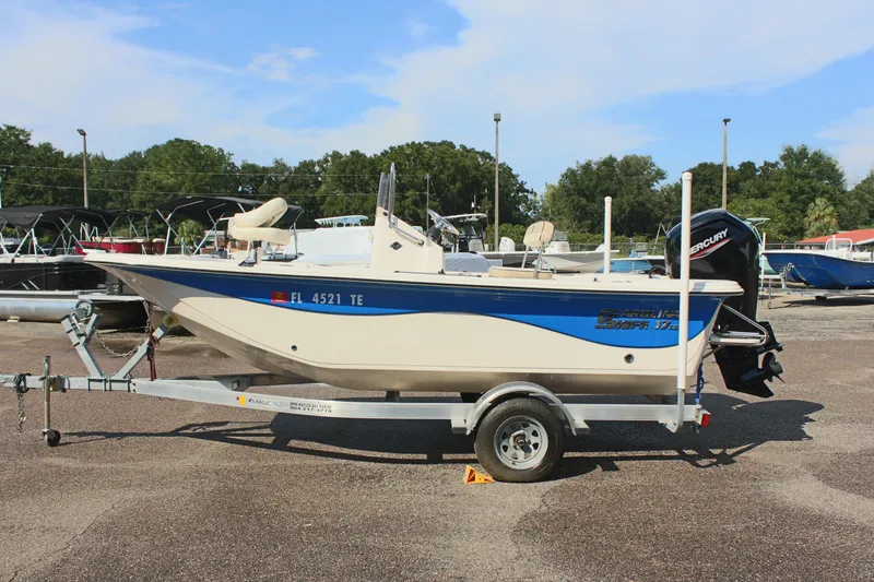 The Image of 2022 Carolina Skiff 17 LS boat on trailer in outdoor lot. - 0
