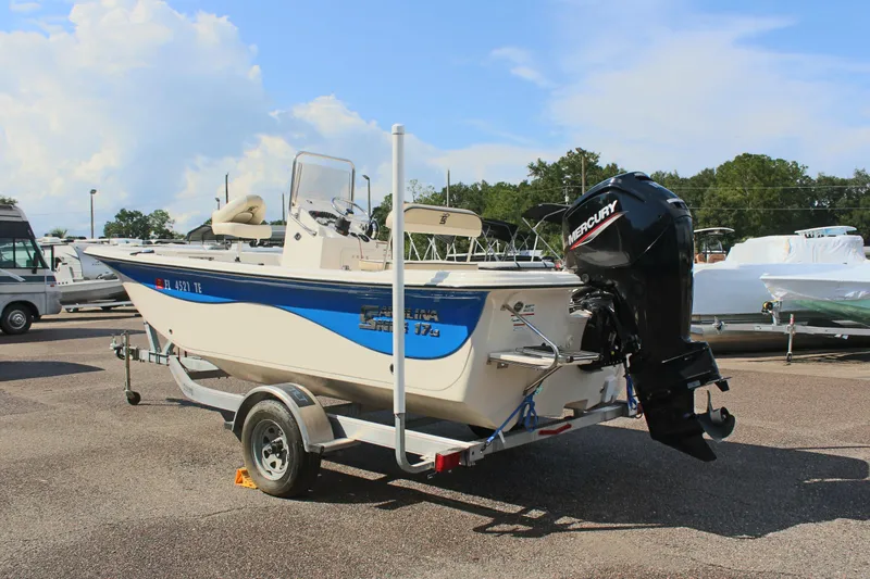 Slide: The Image of 2022 Carolina Skiff 17 LS boat on trailer with Mercury outboard motor. - 10