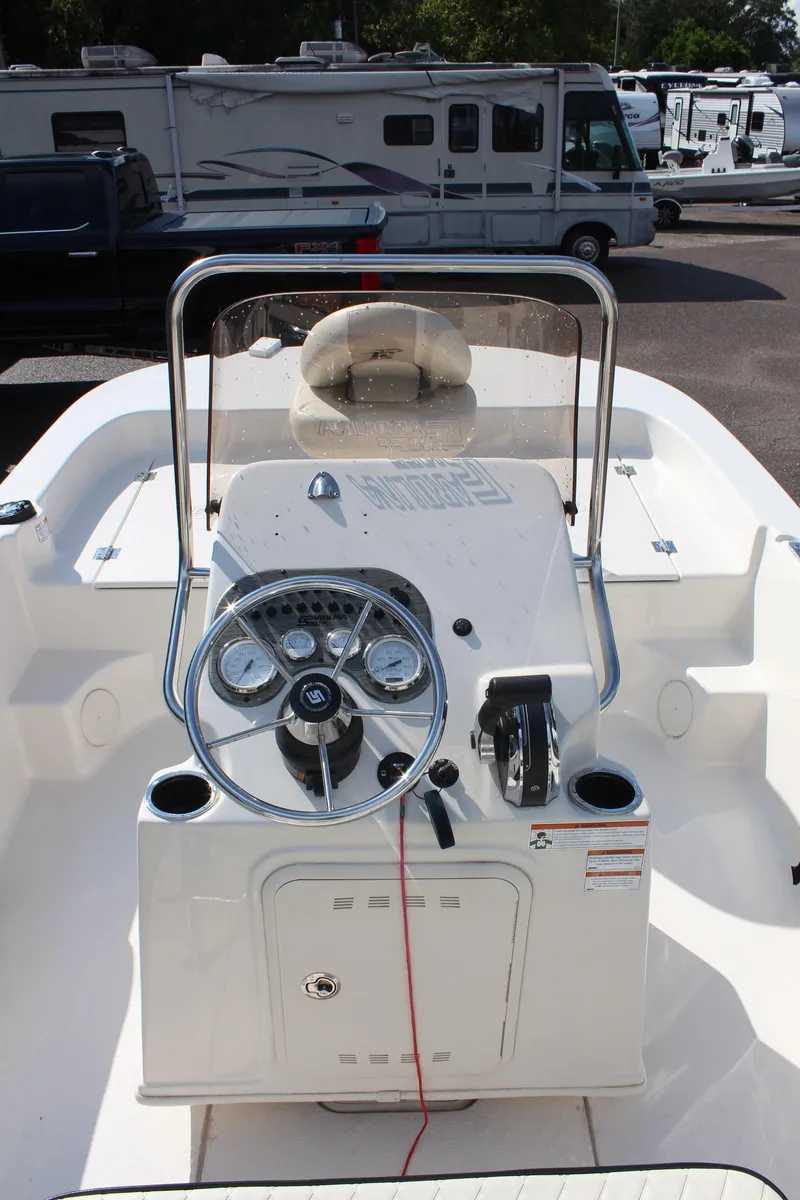 Slide: The Image of 2022 Carolina Skiff 17 LS boat console with steering wheel and controls. - 19