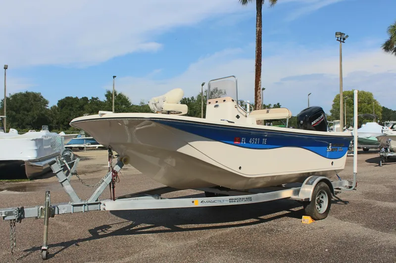 Slide: The Image of 2022 Carolina Skiff 17 LS boat on trailer in parking lot. - 2