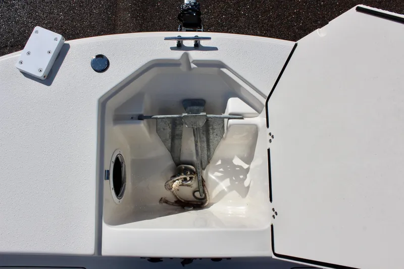 Slide: The Image of 2022 Carolina Skiff 17 LS anchor storage compartment with open hatch. - 28