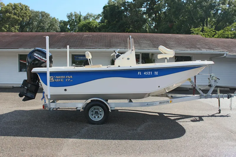 Slide: The Image of 2022 Carolina Skiff 17 LS boat on trailer, parked outdoors. - 7