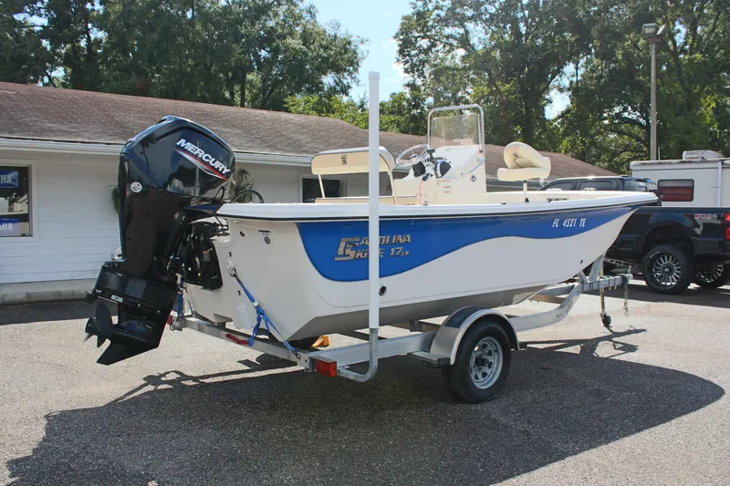 Slide: The Image of 2022 Carolina Skiff 17 LS boat on trailer with Mercury outboard motor. - 8