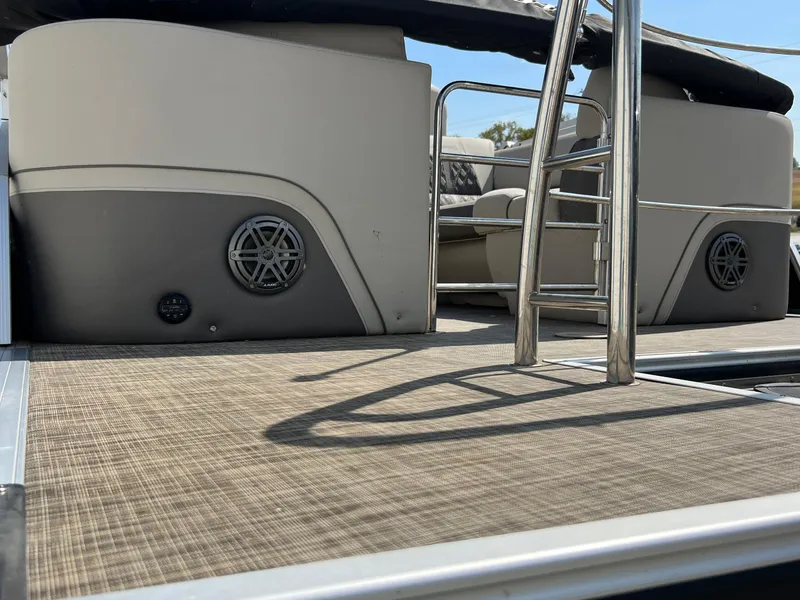 Slide: The Image of 2020 Harris FloteBote H SOL 250 CWDH TT pontoon boat interior with ladder and speakers. - 11