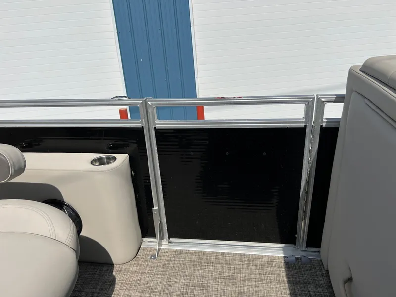 Slide: The Image of 2020 Harris FloteBote H SOL 250 CWDH TT pontoon interior with beige seating and railing. - 22