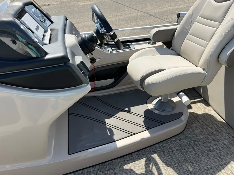 Slide: The Image of 2020 Harris FloteBote H SOL 250 CWDH TT boat interior with steering console and captain's chair. - 24