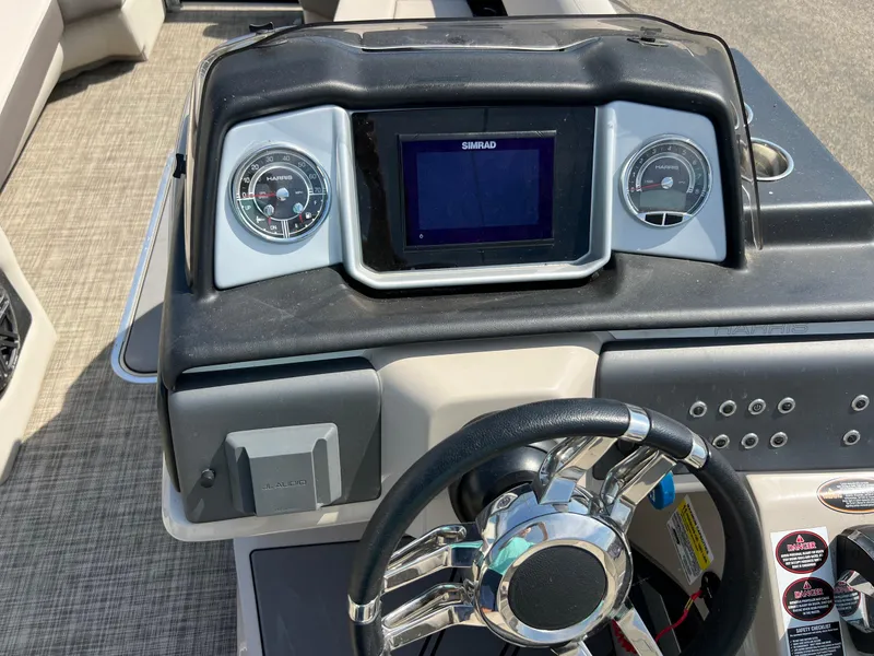 Slide: The Image of Dashboard of 2020 Harris FloteBote H SOL 250 CWDH TT with steering wheel and gauges. - 25