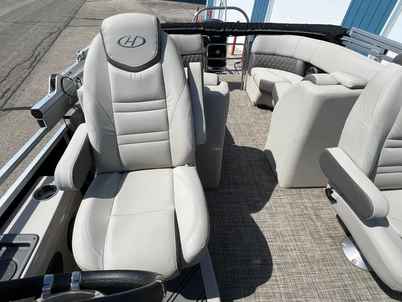 Slide: The Image of 2020 Harris FloteBote H SOL 250 CWDH TT pontoon boat interior with plush seating. - 28