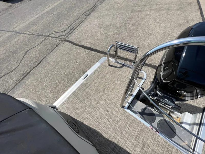 Slide: The Image of 2020 Harris FloteBote H SOL 250 CWDH TT pontoon boat deck with ladder and engine. - 31