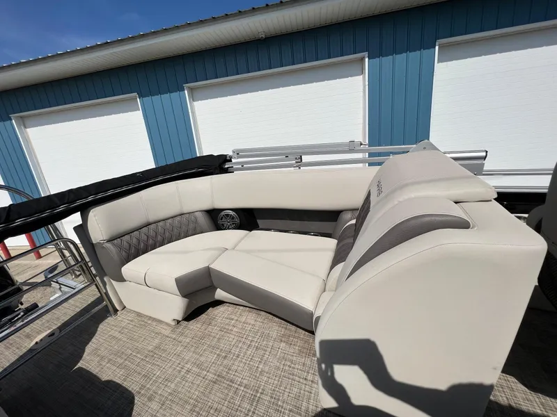 Slide: The Image of 2020 Harris FloteBote H SOL 250 CWDH TT pontoon boat with beige seating and blue exterior. - 35