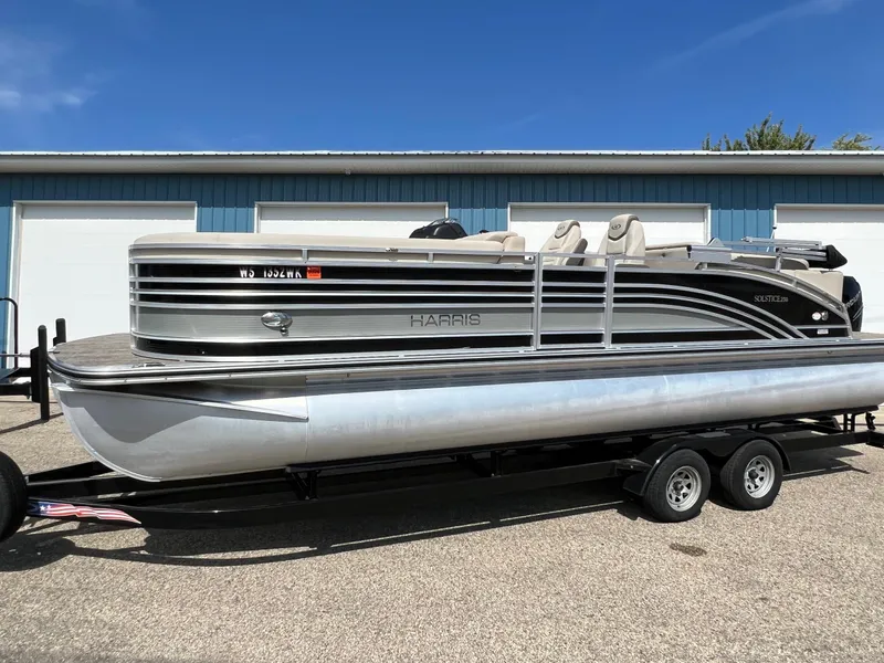 Slide: The Image of 2020 Harris FloteBote H SOL 250 CWDH TT pontoon boat on trailer, parked outdoors. - 39