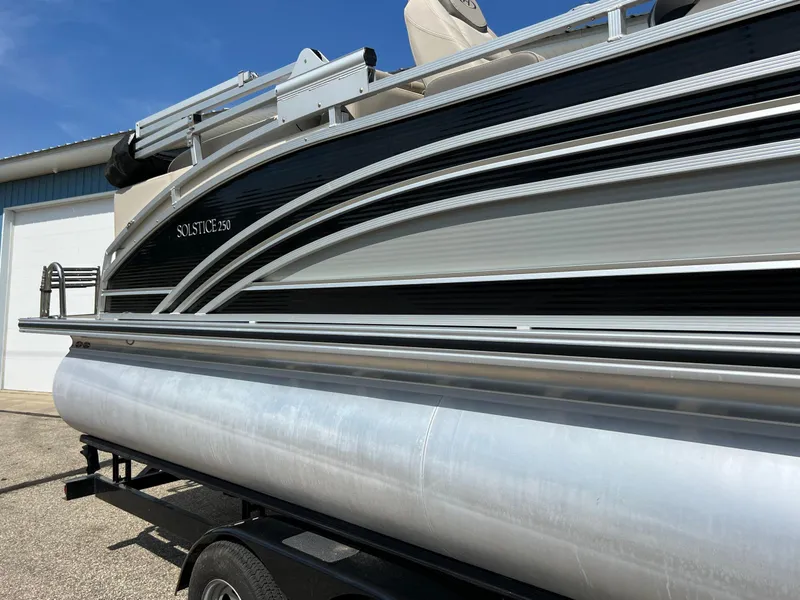 Slide: The Image of 2020 Harris FloteBote H SOL 250 CWDH TT pontoon boat, side view, on trailer. - 7