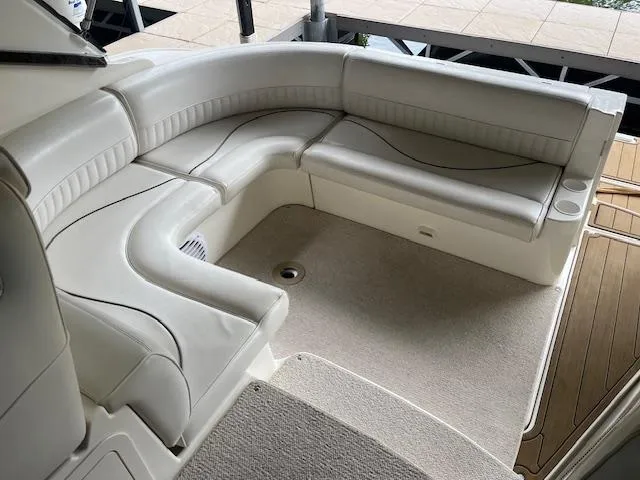 Slide: The Image of 2001 Cruisers Yachts 3470 Express interior with white leather seating. - 11
