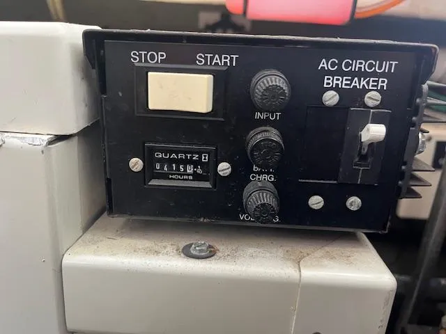 Slide: The Image of Control panel of a 2001 Cruisers Yachts 3470 Express with hour meter and circuit breaker. - 21