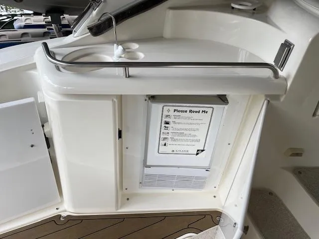Slide: The Image of 2001 Cruisers Yachts 3470 Express interior with sink and storage area. - 7