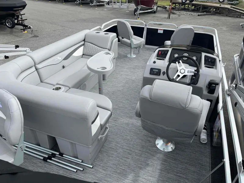 Slide: The Image of 2024 Bennington 20 SVF pontoon boat interior with gray seating and steering console. - 4