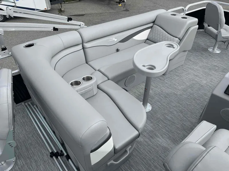 Slide: The Image of 2024 Bennington 20 SVF boat interior with gray seating and cup holders. - 7