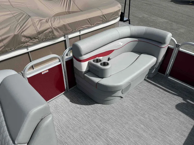 Slide: The Image of 2024 Bennington 20 SVL pontoon boat interior with gray seating and cup holders. - 10