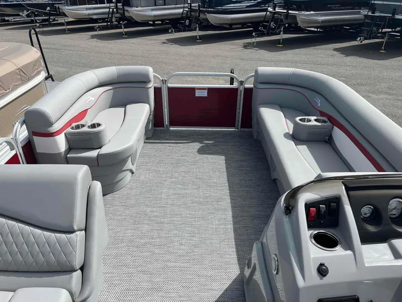 Slide: The Image of 2024 Bennington 20 SVL pontoon boat interior with gray seating and red accents. - 12