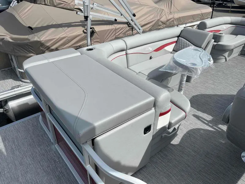 Slide: The Image of 2024 Bennington 20 SVL pontoon boat interior with gray seating and table. - 16