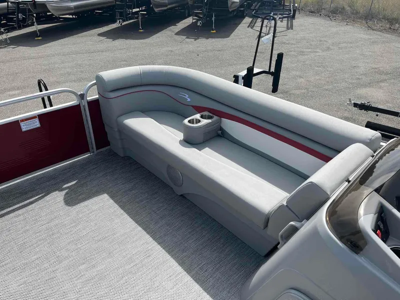 Slide: The Image of 2024 Bennington 20 SVL pontoon boat with gray seating and cup holders. - 8