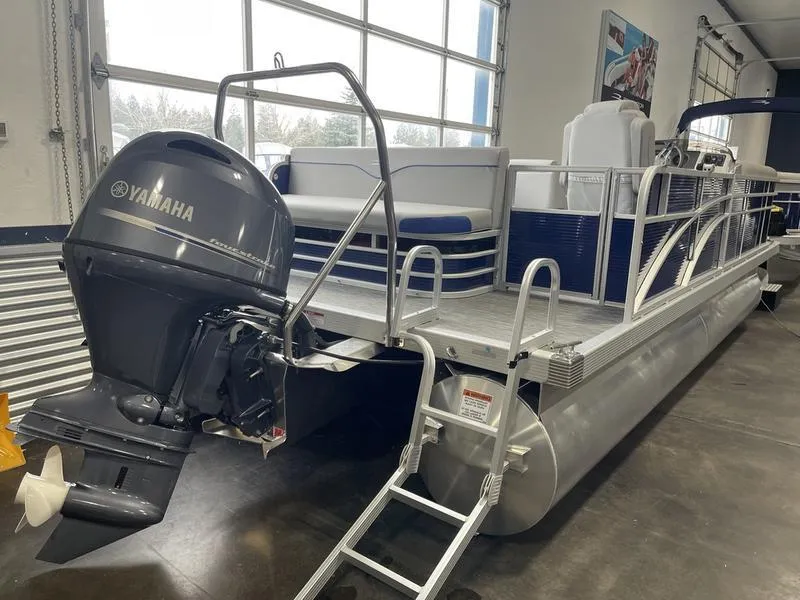 Slide: The Image of 2023 Bennington 218 SLJ pontoon boat with Yamaha outboard motor in showroom. - 10