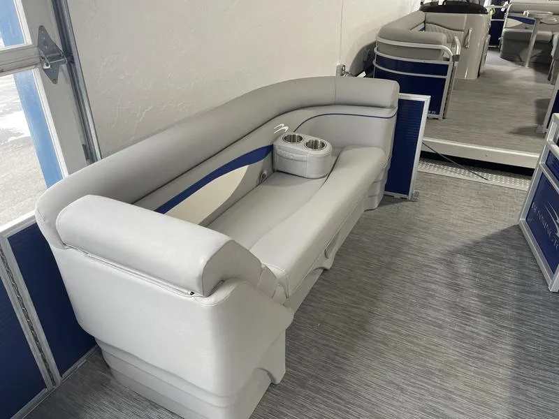 Slide: The Image of 2023 Bennington 218 SLJ boat interior with gray seating and cup holders. - 4