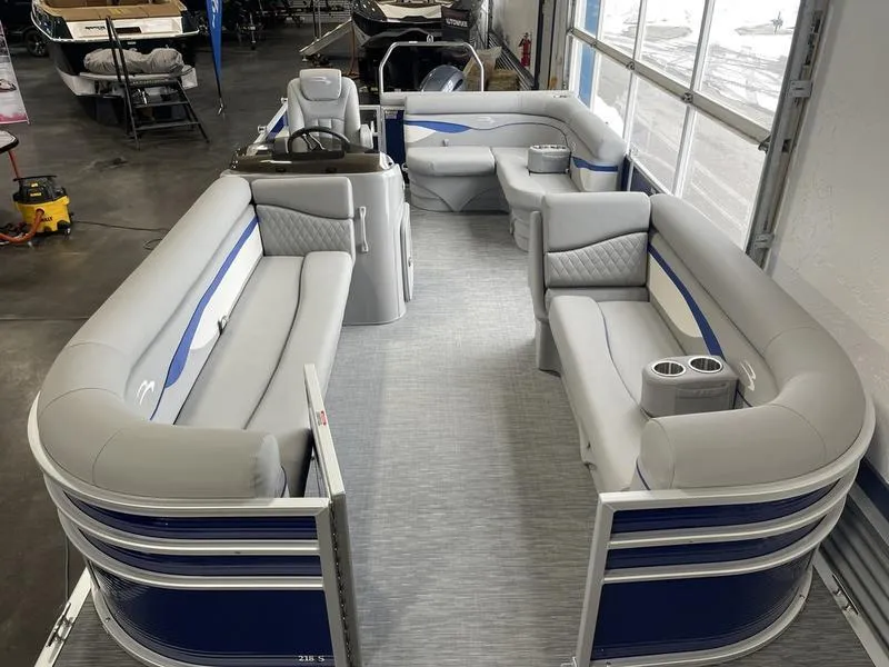 Slide: The Image of 2023 Bennington 218 SLJ pontoon boat with spacious seating and modern design. - 6