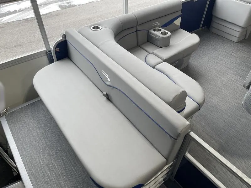 Slide: The Image of 2023 Bennington 218 SLJ pontoon boat interior with gray seating and cup holders. - 7