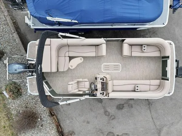 Slide: The Image of 2023 Bennington 22 SL pontoon boat, aerial view, spacious seating, modern design. - 3