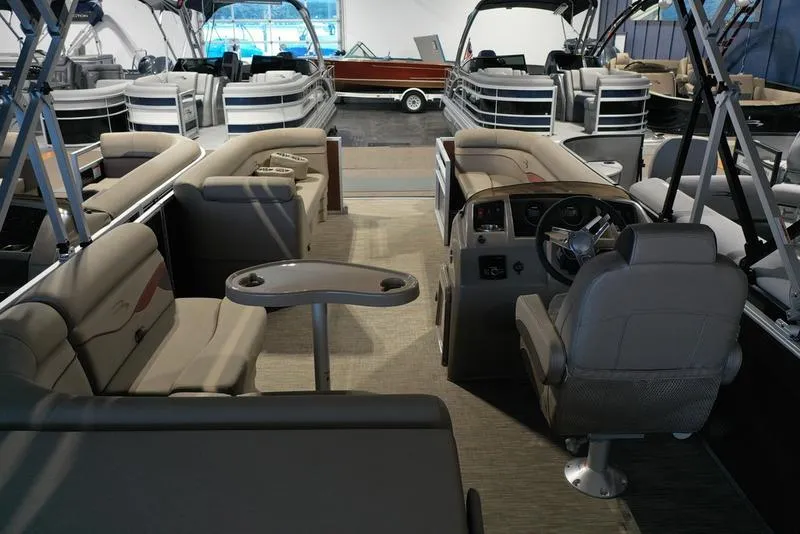 Slide: The Image of 2023 Bennington 22 SS pontoon boat interior with seating and helm. - 15