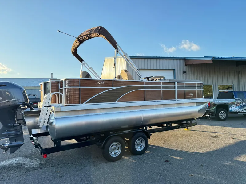 Slide: The Image of 2023 Bennington 22 SS pontoon boat on trailer, parked outdoors. - 3