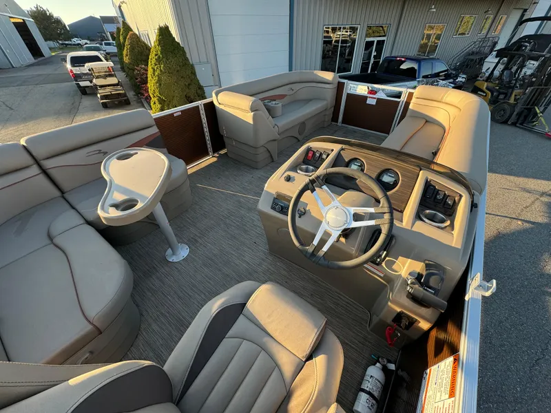 Slide: The Image of 2023 Bennington 22 SS pontoon boat interior with steering console and seating. - 6
